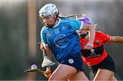 12 February 2023; Megan Dowdall of TUD in action against Meadhbh Ring of UCC during the Electric Ireland Ashbourne Cup Final between UCC and TUD at UCD in Dublin. Photo by Ben McShane/Sportsfile