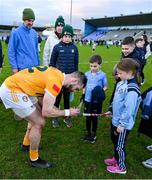 12 February 2023; Neil McManus of Antrim signs an authogaph for Éabha Heery, Fingallians, after the Allianz Hurling League Division 1 Group B match between Dublin and Antrim at Parnell Park in Dublin. Photo by Ray McManus/Sportsfile