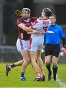12 February 2023; Eoin Downey of Cork tussles with Padraic Mannion of Galway during the Allianz Hurling League Division 1 Group A match between Galway and Cork at Pearse Stadium in Galway. Photo by Seb Daly/Sportsfile