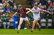 12 February 2023; Kevin Cooney of Galway in action against Eoin Downey of Cork during the Allianz Hurling League Division 1 Group A match between Galway and Cork at Pearse Stadium in Galway. Photo by Seb Daly/Sportsfile