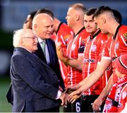 10 February 2023; President of Ireland Michael D Higgins in the company of FAI President Gerry McAnaney meet the Derry City players before the FAI President's Cup match between Derry City and Shamrock Rovers at the Ryan McBride Brandywell Stadium in Derry. Photo by Stephen McCarthy/Sportsfile