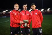 10 February 2023; Derry City players, from left, Darragh McCloskey, Conor Barr and Liam Mullan pose with the FAI President's Cup after the FAI President's Cup match between Derry City and Shamrock Rovers at the Ryan McBride Brandywell Stadium in Derry. Photo by Stephen McCarthy/Sportsfile