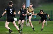 14 February 2023; Shane Allen of TUS Midlands in action against TUS Midwest players Ciaran McMahon, Sean McNamara and Patrick Doherty during the Electric Ireland HE Trench Cup Semi-Final match between TUS Midlands and TUS Midwest at SETU West Campus in Waterford. Photo by Brendan Moran/Sportsfile