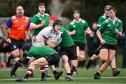 15 February 2023; Shane McGuigan of Midlands is tackled by Ryan Donohoe, left, and Bill Blyth of South East during the Leinster Rugby Shane Horgan Round Four match between Midlands and South East at Skerries RFC in Skerries, Dublin. Photo by Piaras Ó Mídheach/Sportsfile