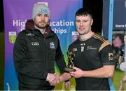 15 February 2023; Cathal Flynn of TUS Midlands is presented with the player of the match by Higher Education GAA chairperson Mike Hyland after the Electric Ireland HE Trench Cup Final match between Dundalk Institute of Technology and Technological University of the Shannon Midlands at SETU West Campus in Waterford. Photo by Brendan Moran/Sportsfile