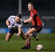 15 February 2023; Darragh Cashman of UL in action against Jack Murphy of UCC during the Electric Ireland HE GAA Sigerson Cup Final match between University of Limerick and University College Cork at WIT Sports Campus in Waterford. Photo by Stephen Marken/Sportsfile
