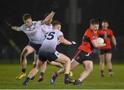 15 February 2023; Fionn Herlihy of UCC is tackled by Paul Keaney and Darragh Cashman of UL during the Electric Ireland HE GAA Sigerson Cup Final match between University of Limerick and University College Cork at WIT Sports Campus in Waterford. Photo by Brendan Moran/Sportsfile