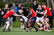 15 February 2023; Evan Hayes of Metro in action against Robert Wogan, 16, and Sam Manuel of North East during the Leinster Rugby Shane Horgan Round Four match between Metro and North East at Skerries RFC in Skerries, Dublin. Photo by Piaras Ó Mídheach/Sportsfile
