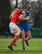 16 February 2023; Katie Corrigan of Leinster is tackled by Fia Whelan of Munster during the U18 Girls Interprovincial match between Leinster and Munster at Terenure College in Dublin. Photo by Harry Murphy/Sportsfile