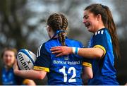 16 February 2023; Caoimhe McCormack of Leinster, 12, celebrates with teammate Georgia Young after scoring her side's fourth try during the U18 Girls Interprovincial match between Leinster and Munster at Terenure College in Dublin. Photo by Harry Murphy/Sportsfile