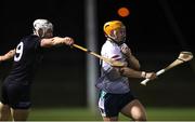 16 February 2023; Adam English of University of Limerick in action against Gavin Fives of SETU Waterford during the Electric Ireland HE GAA Fitzgibbon Cup Semi-Final match between SETU Waterford and UL at SETU West Campus in Waterford. Photo by Michael P Ryan/Sportsfile