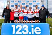 12 February 2023; Athletices Ireland president John Cronin, right, with the Galway City Harriers team and coaching staff, including athletes, from left, Gene Kelly, John Moroney, Conor Byrne, Andrew O'Donnghaile and Aaron Brennan, after they finished third in the intermediate men's club team competition during the 123.ie National Intermediate, Masters & Juvenile B Cross Country Championships at Gowran Demense in Kilkenny. Photo by Sam Barnes/Sportsfile
