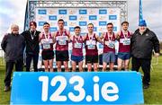 12 February 2023; Athletices Ireland president John Cronin, right,  with the Mullingar Harriers team and coaching staff, including athletes from left, Vinny Connolly, Kedagh Geoghegan, Ian McCormack, Andrew Nevin, James Keegan and Brian Martin, after they finished second in the intermediate men's club team competition during the 123.ie National Intermediate, Masters & Juvenile B Cross Country Championships at Gowran Demense in Kilkenny. Photo by Sam Barnes/Sportsfile