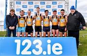 12 February 2023; Athletices Ireland president John Cronin, right, with the Annadale Strides team and coaching staff, including athletes from left, Cameron Stewart, Timothy Johnston, Luke Dinsmore, Adam Spratt, Jimmy Sloan and Jonathan Spratt, after they finished first in the intermediate men's club team competition during the 123.ie National Intermediate, Masters & Juvenile B Cross Country Championships at Gowran Demense in Kilkenny. Photo by Sam Barnes/Sportsfile