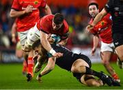 17 February 2023; Jack O'Donoghue of Munster is tackled by Max Nagy of Ospreys during the United Rugby Championship match between Munster and Ospreys at Thomond Park in Limerick. Photo by Harry Murphy/Sportsfile