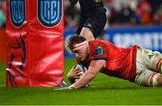 17 February 2023; Gavin Coombes of Munster dives over to score his side's first try during the United Rugby Championship match between Munster and Ospreys at Thomond Park in Limerick. Photo by Harry Murphy/Sportsfile