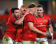17 February 2023; Gavin Coombes of Munster celebrates with teammates Paddy Patterson, Roman Salanoa and Shane Daly after scoring his side's first try during the United Rugby Championship match between Munster and Ospreys at Thomond Park in Limerick. Photo by Harry Murphy/Sportsfile