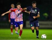 17 February 2023; Guillermo Almirall of Bray Wanderers in action against Colin Conroy of Treaty United during the SSE Airtricity Men's First Division match between Treaty United and Bray Wanderers at Market's Field in Limerick. Photo by Michael P Ryan/Sportsfile