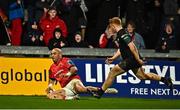 17 February 2023; Simon Zebo of Munster scores his side's seventh try despitethe efforts of Lestyn Hopkins of Ospreys during the United Rugby Championship match between Munster and Ospreys at Thomond Park in Limerick. Photo by Sam Barnes/Sportsfile