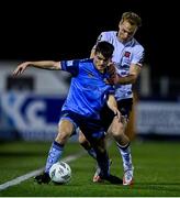 17 February 2023; Donal Higgins of UCD in action against Greg Sloggett of Dundalk during the SSE Airtricity Men's Premier Division match between Dundalk and UCD at Oriel Park in Dundalk, Louth. Photo by Ben McShane/Sportsfile