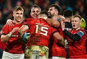 17 February 2023; Shane Daly of Munster, 15, is  congratulated by  team-mates after scoring his side's eighth try during the United Rugby Championship match between Munster and Ospreys at Thomond Park in Limerick. Photo by Sam Barnes/Sportsfile