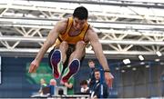 18 February 2023; Sam Healy of Leevale AC, Cork, on his way to winning the senior men's Long Jump   during day one of the 123.ie National Senior Indoor Championships at National Indoor Arena in Dublin. Photo by Sam Barnes/Sportsfile