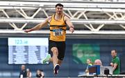 18 February 2023; Sam Healy of Leevale AC, Cork, on his way to winning the senior men's Long Jump during day one of the 123.ie National Senior Indoor Championships at National Indoor Arena in Dublin. Photo by Sam Barnes/Sportsfile