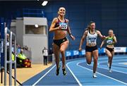 18 February 2023; Sharlene Mawdsley of Newport AC, Tipperary, left, on her way  to winning the senior women's 200m during day one of the 123.ie National Senior Indoor Championships at National Indoor Arena in Dublin. Photo by Sam Barnes/Sportsfile