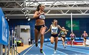 18 February 2023; Sharlene Mawdsley of Newport AC, Tipperary, left, crosses the line to win the senior women's 200m during day one of the 123.ie National Senior Indoor Championships at National Indoor Arena in Dublin. Photo by Sam Barnes/Sportsfile