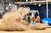 18 February 2023; Saragh Buggy of St Abbans AC, Laois, on her way to winning the senior women's Triple Jump  during day one of the 123.ie National Senior Indoor Championships at National Indoor Arena in Dublin. Photo by Sam Barnes/Sportsfile