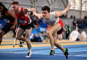 18 February 2023; Matthew Behan of Crusaders AC, Dublin, right, dips for the line to win the senior men's 60m Hurdles during day one of the 123.ie National Senior Indoor Championships at National Indoor Arena in Dublin. Photo by Sam Barnes/Sportsfile