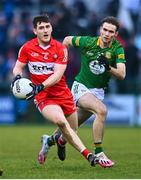 18 February 2023; Padraig McGrogan of Derry in action against Cathal Hickey of Meath during the Allianz Football League Division Two match between Derry and Meath at Derry GAA Centre of Excellence in Owenbeg, Derry. Photo by Ben McShane/Sportsfile