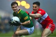 18 February 2023; Cathal Hickey of Meath is tackled by Shane McGuigan of Derry during the Allianz Football League Division Two match between Derry and Meath at Derry GAA Centre of Excellence in Owenbeg, Derry. Photo by Ben McShane/Sportsfile