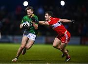 18 February 2023; Cathal Hickey of Meath in action against Padraig McGrogan of Derry during the Allianz Football League Division Two match between Derry and Meath at Derry GAA Centre of Excellence in Owenbeg, Derry. Photo by Ben McShane/Sportsfile