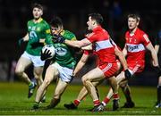 18 February 2023; Eoin Harkin of Meath is tackled by Padraig McGrogan of Derry during the Allianz Football League Division Two match between Derry and Meath at Derry GAA Centre of Excellence in Owenbeg, Derry. Photo by Ben McShane/Sportsfile