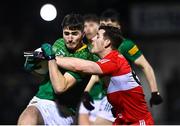 18 February 2023; Diarmuid Moriarty of Meath is tackled by Padraig McGrogan of Derry during the Allianz Football League Division Two match between Derry and Meath at Derry GAA Centre of Excellence in Owenbeg, Derry. Photo by Ben McShane/Sportsfile