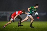 18 February 2023; Diarmuid Moriarty of Meath in action against Brendan Rogers of Derry during the Allianz Football League Division Two match between Derry and Meath at Derry GAA Centre of Excellence in Owenbeg, Derry. Photo by Ben McShane/Sportsfile