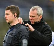18 February 2023; Referee Barry Tiernan has his radio fitted by Fergal Kelly before the Allianz Football League Division Four match between Wicklow and London at Echelon Park in Aughrim, Wicklow. Photo by Stephen Marken/Sportsfile