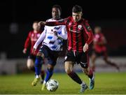 18 February 2023; Joshua Giurgi of Longford Town in action against Jamar Campion-Hinds of Athlone Town during the SSE Airtricity Men's First Division match between Longford Town and Athlone Town at Bishopsgate in Longford. Photo by Michael P Ryan/Sportsfile
