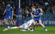 18 February 2023; Jamie Osborne of Leinster is tackled by Steff Hughes of Dragons during the United Rugby Championship match between Leinster and Dragons at RDS Arena in Dublin. Photo by Harry Murphy/Sportsfile