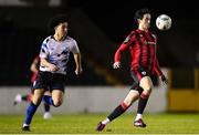 18 February 2023; Sam Verdon of Longford Town in action against Charles Mutawe of Athlone Town during the SSE Airtricity Men's First Division match between Longford Town and Athlone Town at Bishopsgate in Longford. Photo by Michael P Ryan/Sportsfile