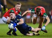 18 February 2023; Paudie Clifford of Kerry is tackled by Ryan O'Donoghue and Donnacha McHugh of Mayo during the Allianz Football League Division One match between Mayo and Kerry at Hastings Insurance MacHale Park in Castlebar, Mayo. Photo by Brendan Moran/Sportsfile