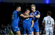 18 February 2023; Luke McGrath of Leinster celebrates with teammates, from left, Dave Kearney, Liam Turner and Jamie Osborne after scoring his side's second try during the United Rugby Championship match between Leinster and Dragons at RDS Arena in Dublin. Photo by Harry Murphy/Sportsfile