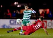 18 February 2023; Dylan Watts of Shamrock Rovers in action against Lukas Browning of Sligo Rovers during the SSE Airtricity Men's Premier Division match between Sligo Rovers and Shamrock Rovers at The Showgrounds in Sligo. Photo by Seb Daly/Sportsfile