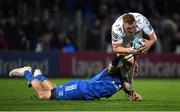 18 February 2023; Ben Fry of Dragons is tackled by Rhys Ruddock of Leinster during the United Rugby Championship match between Leinster and Dragons at RDS Arena in Dublin. Photo by Tyler Miller/Sportsfile