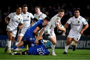 18 February 2023; Steff Hughes of Dragons is tackled by Will Connors, bottom, and Lee Barron of Leinster during the United Rugby Championship match between Leinster and Dragons at RDS Arena in Dublin. Photo by Tyler Miller/Sportsfile