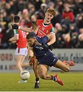 18 February 2023; Stefan Okunbor of Kerry is tackled by Jack Carney of Mayo during the Allianz Football League Division One match between Mayo and Kerry at Hastings Insurance MacHale Park in Castlebar, Mayo. Photo by Brendan Moran/Sportsfile