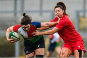 18 February 2023; Deirbhile Nic a Bhaird of Combined Provinces XV is tackled by Caitlin Lewis, left, and Robyn Wilkins of Wales Development XV during the Celtic Challenge 2023 match between Combined Provinces XV and Welsh Development XV at Kingspan Stadium in Belfast. Photo by Ramsey Cardy/Sportsfile