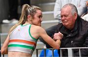 19 February 2023; Cheryl Nolan of St Abbans AC, Laois, celebrates with Pat Kelly after winning the senior women's 3000 during day two of the 123.ie National Senior Indoor Championships at National Indoor Arena in Dublin. Photo by Sam Barnes/Sportsfile
