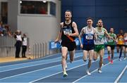 19 February 2023; Eoin Pierce of Clonliffe Harriers AC, Dublin, left, on his way to winning the senior men's 1500m during day two of the 123.ie National Senior Indoor Championships at National Indoor Arena in Dublin. Photo by Sam Barnes/Sportsfile